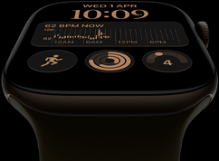 Apple Watch Series 12, aluminum case, dark bronze color, Modular watch face, complications: day and date, Workouts, Activity rings, Apple Music, right side exterior, Digital Crown, Sport Band, olive color