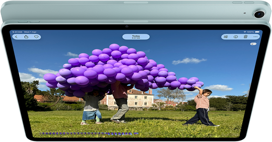 iPad Air, Blue color, top exterior, screen showing Keynote app on screen sharing feature during FaceTime video call, back exterior, 12MP Wide back camera, volume-up button, volume-down button