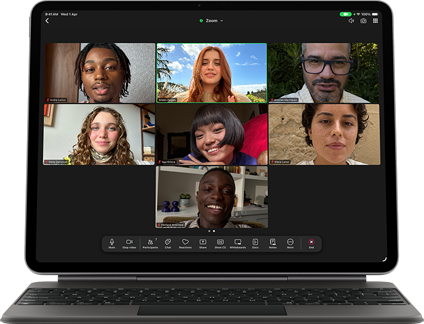 iPad Air, attached to Magic Keyboard, Black color, Group FaceTime call on screen