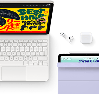 iPad Air, Starlight color, colorful graphics on screen, attached to Magic Keyboard, Airpods Pro and Apple Pencil Pro accessories