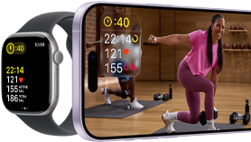 Apple Watch next to iPhone with Apple Fitness+ class on screen